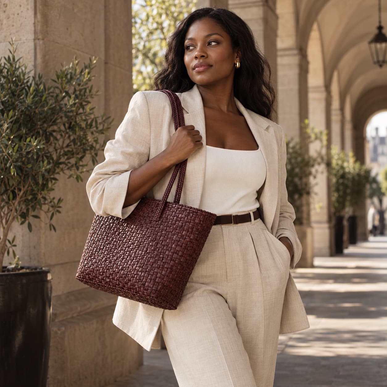 A shopper carrying a woven tote